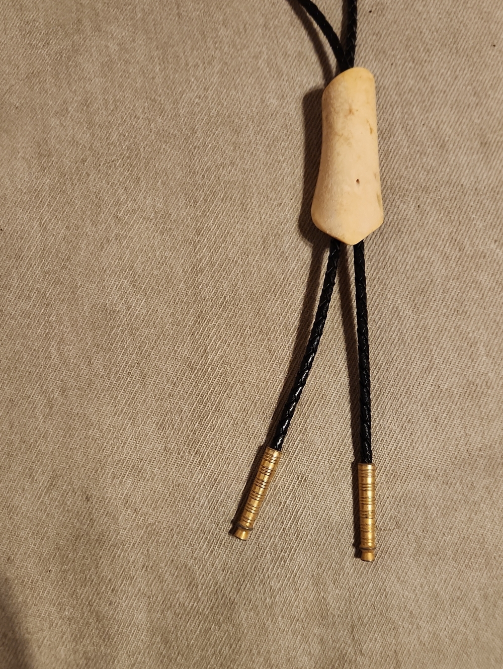 Men's Black Bolo Tie with Cream Slide and Gold Tips